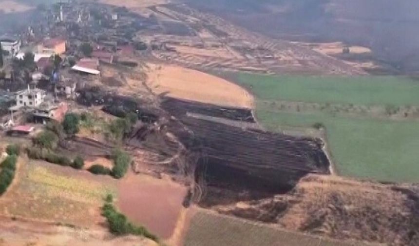 Orman yangını yağmurla yavaşladı: Havadan görüntüler yürek burktu